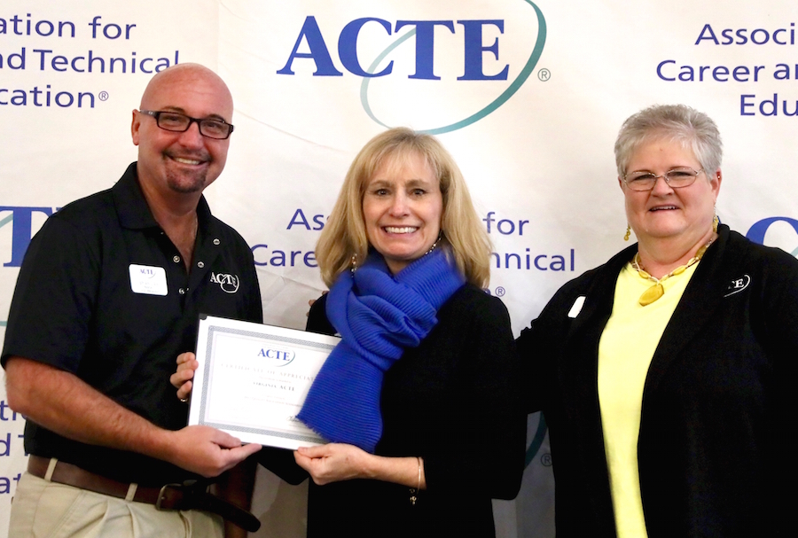 Mary Eckert accepts award